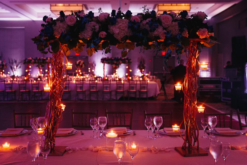 Beautiful pink decorated wedding serving with centerpiece and li